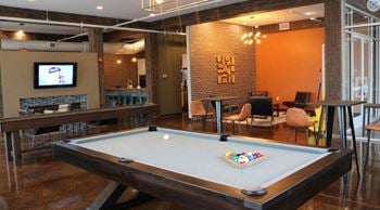 Clubhouse gameroom with pool table, full kitchen, and social lounge.